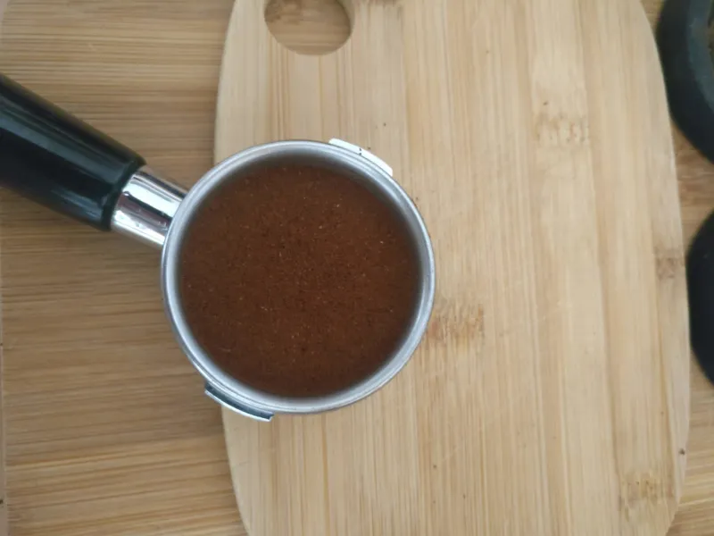 The coffee has been tamped in the portafilter