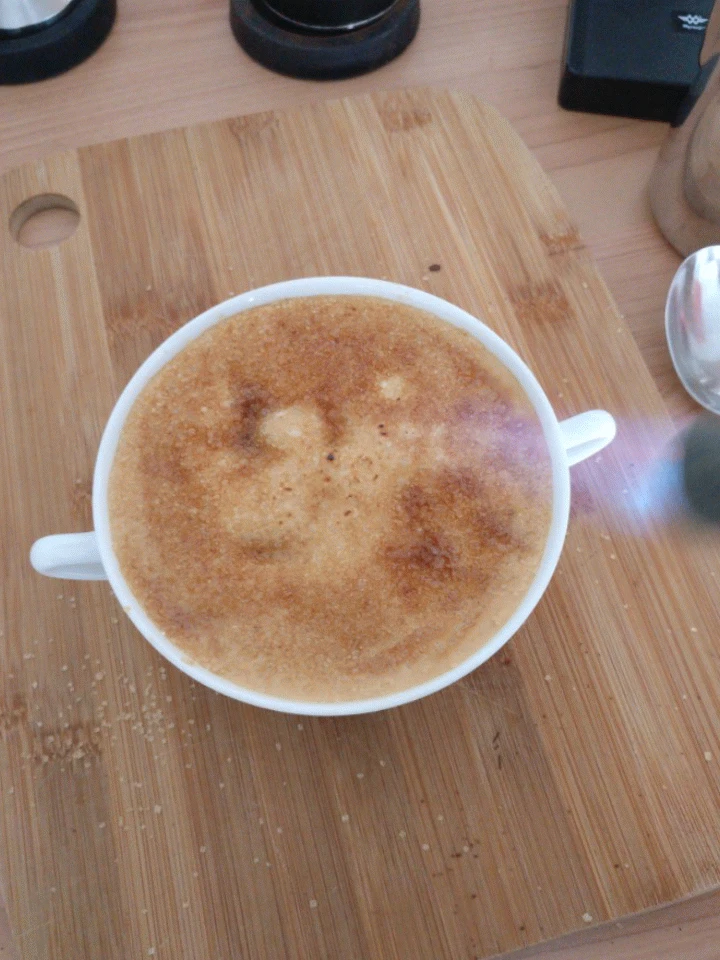 The brown sugar is caramelized using the blowtorch