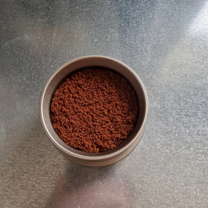 Filling the Picopresso basket with ground coffee