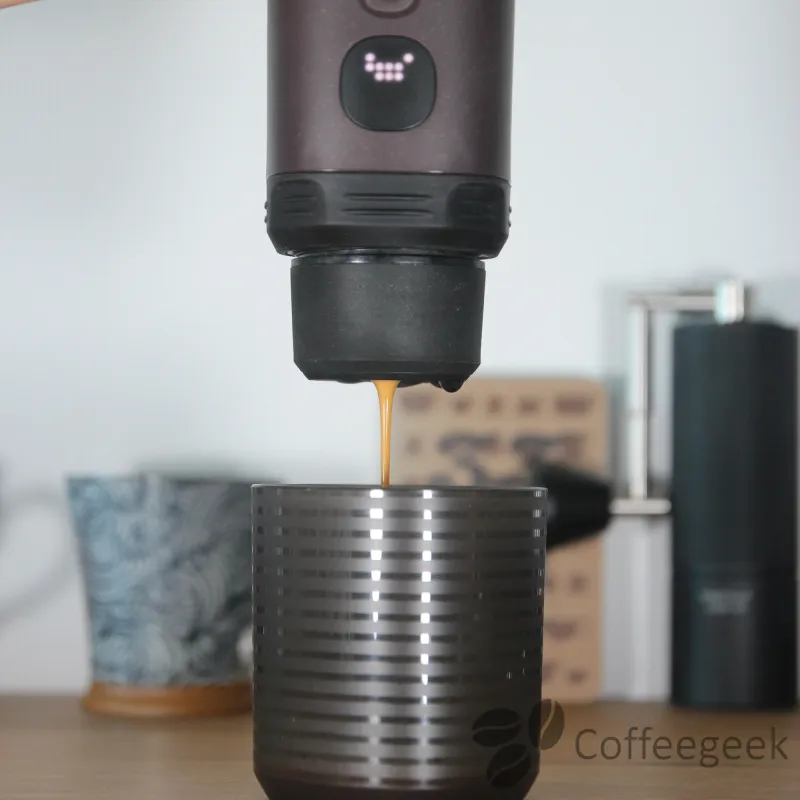 Extraction in progress: when the Nespresso capsule is pierced, a pop is heard.