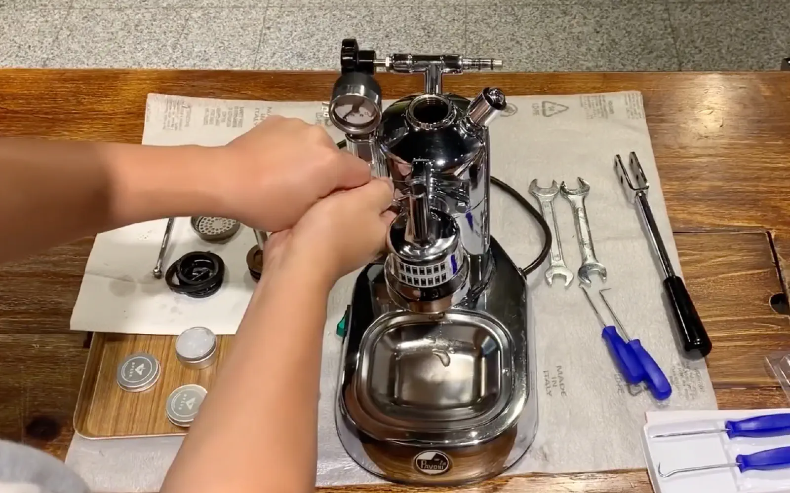 Unscrew the group head bolts